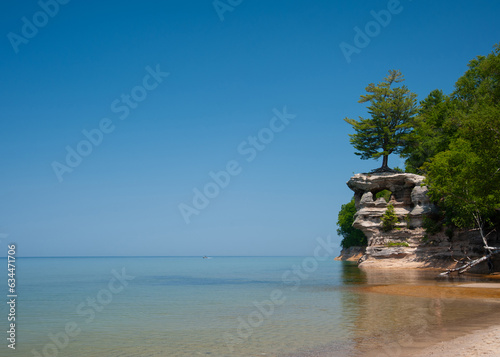 Chapel Rock Pictured Rocks national lakeshore Michigan Lake Superior Beach blue sky with cliff and tree tropical