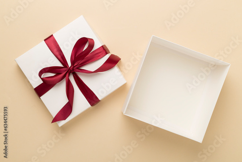 Open gift box on color background, top view. Mock up for design