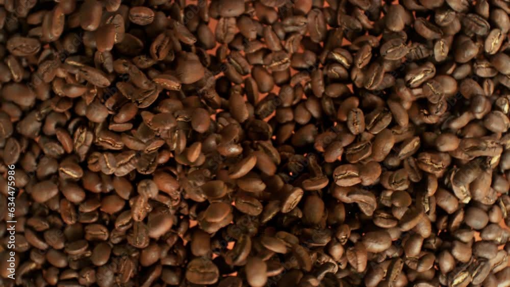 Super Slow Motion Shot of Flying Fresh Coffee Beans Towards at 1000fps. Super Slow Motion Shot of Flying Fresh Coffee Beans Towards at 1000fps.