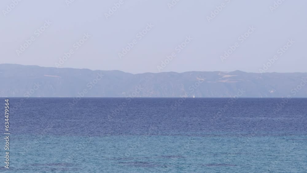a white waves in the blue sea on the beach a white waves in the blue sea on the beach