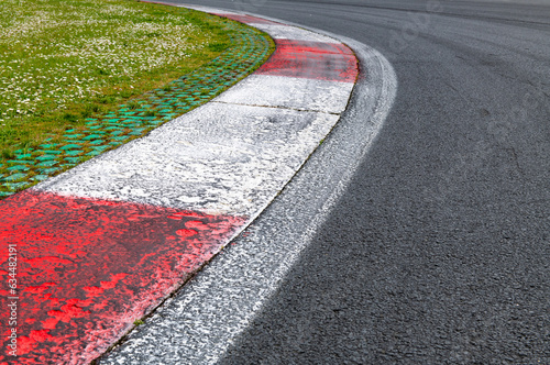 Motor sport asphalt race track and curbs with skid marks, low angle view © fabioderby