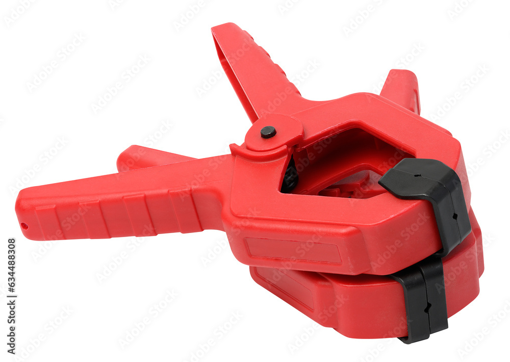 Large red plastic clamp on a white isolated background Large red plastic clamp on a white isolated background