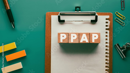 There is wood cube with the word PPAP. It is an abbreviation for PPAP as eye-catching image. photo