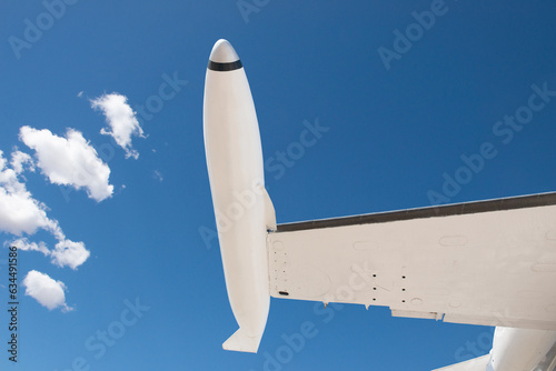 Close-up of a business jet with wingtip pods in flight photo