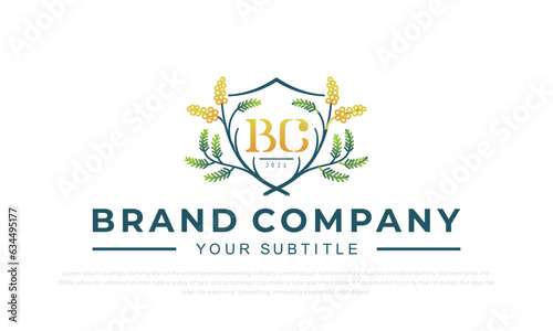 wattle logo with shield shape in badge emblem style
