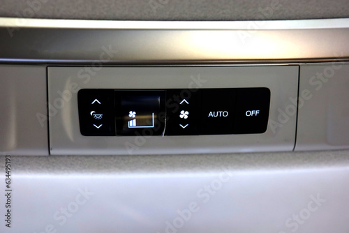 AC button on ceiling of luxury car for rear passengers in big SUV car. car air conditioner with three zone system