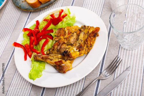Appetizing chicken drumsticks with lettuce and corn grains