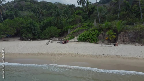 Colombian coastal serenity: aerial drone journey through Tyrona national park drone footage of nature shoreline