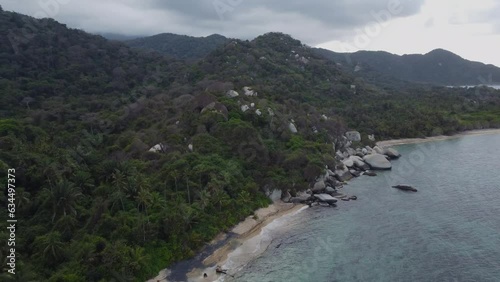 Colombian coastal serenity: aerial drone journey through Tyrona national park drone footage of nature shoreline