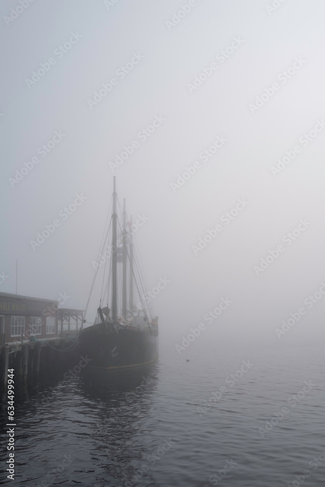 Halifax Harbor foggy morning with a moored boat in Nova Scotia, Canada
