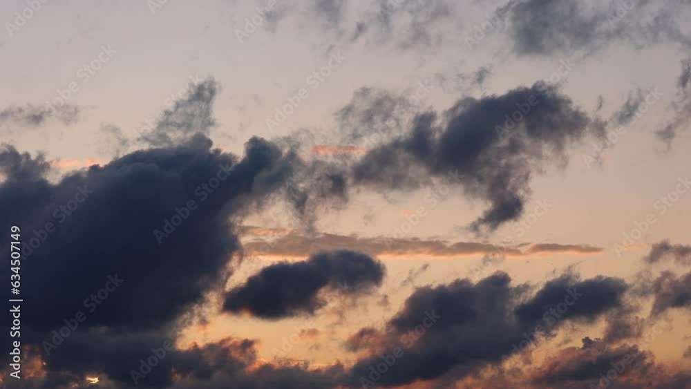 Blue sky after rain,. Beautiful Cumulus clouds flying across the sky, sunset rays, pink and orange shades in the clouds, deep blue sky Blue sky after rain,. Beautiful Cumulus clouds flying across the sky, sunset rays, pink and orange shades in the clouds, deep blue sky