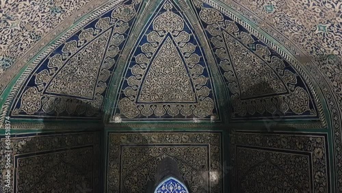 Tomb and Oriental Walls in Pahlavan Mahmud Mausoleum, Khiva, Uzbekistan, Tilt Up Revealing Shot photo