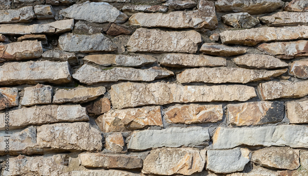 Fototapeta premium Background of unshape stone or rock wall