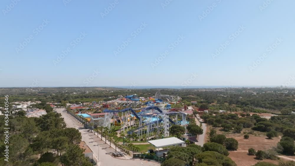 bright blue orange water slides park in algarve portugal, Aerial reverse dolly bright blue orange water slides park in algarve portugal, Aerial reverse dolly
