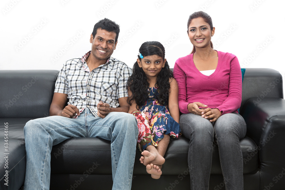 Parents and child relaxing at home on sofa. Parents and child relaxing at home on sofa.