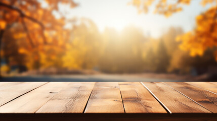 Wooden table top with blur background of autumn