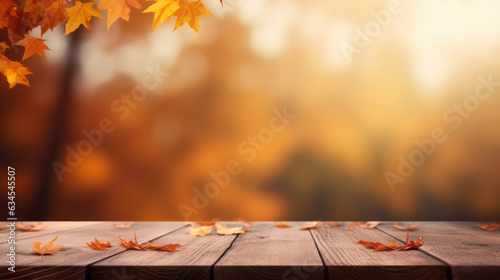 Wooden table top with blur background of autumn