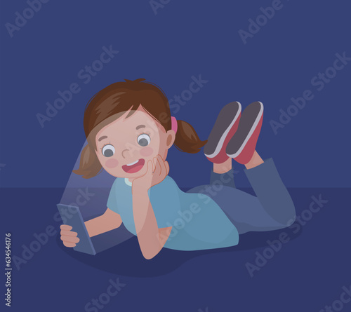 little girl using smartphone lying on the floor at night in the darkroom