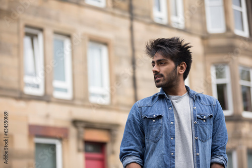 Asian man outdoors in the street.