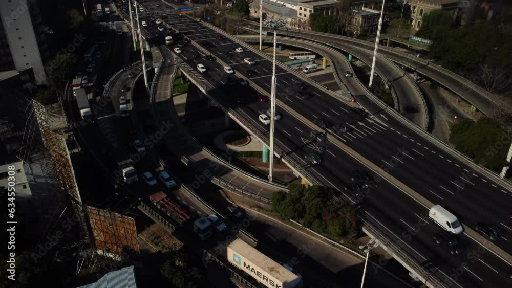 Large road junction in Buenos Aires, many tracks in different directions, summer, time lapse Large road junction in Buenos Aires, many tracks in different directions, summer, time lapse