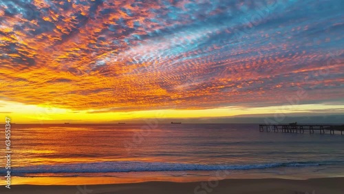 Sunrise seascape with cloud filled sky at Catherine Hill Bay on the Central Coast of NSW, Australia. photo