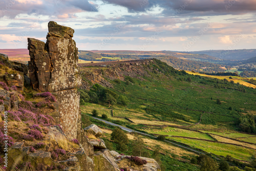 View from Curbar Edge towards Baslow Edge with the dominant rock formation of the Pinnacle Stone, or Rock, in the foreground, Peak District National Park, Derbyshire.