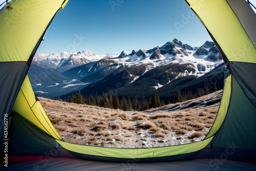 outdoor view from within a camping tent, with mountains and valley unfolding on a bright sunny day