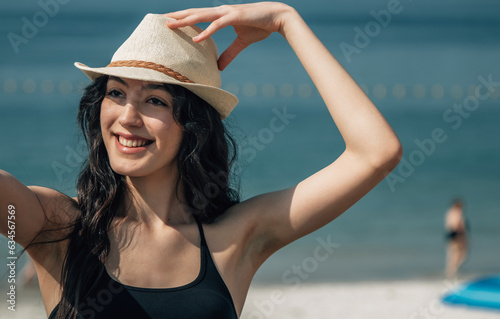 smiling girl on the beach with mobile phone © tetxu