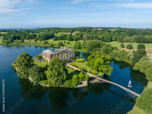 Fototapeta Naklejka Na Ścianę i Meble -  Wakefield, Walton Hall island and lake at Waterton Park in Wakefield West Yorkshire. Aerial view of the hall and island in the summer