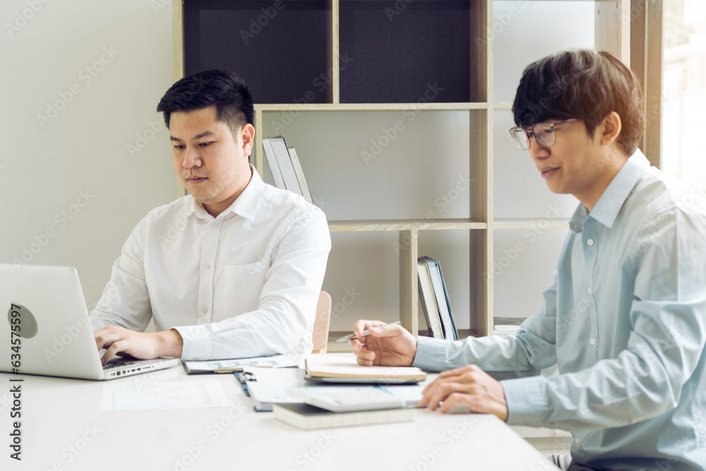 Businessmen working together in the office. Businessmen working together in the office.