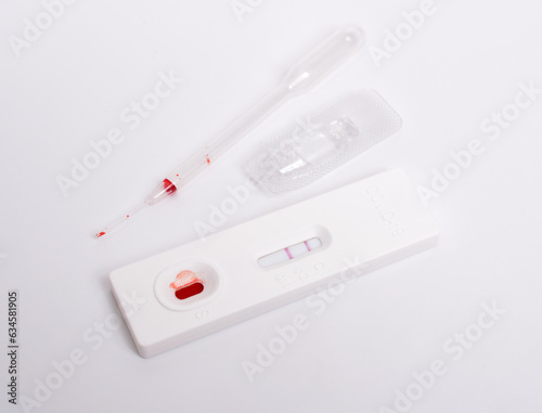 SARS COV 2 Antigen rapid test. Used, positive. On white background