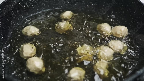 Friying meat ball on a pan photo