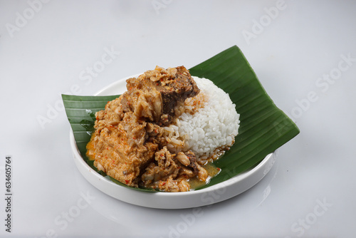 Tumpang Koyor is Indonesian Traditional Dish from Salatiga, made from Fatty Meat with Tempeh in Savory and Spicy Sauce, Served with Rice. photo