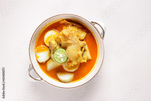 Lontong Kikil is Traditional Indonesian Food from Surabaya Jawa Timur, Made From Beef Legs and Rice Cake. photo