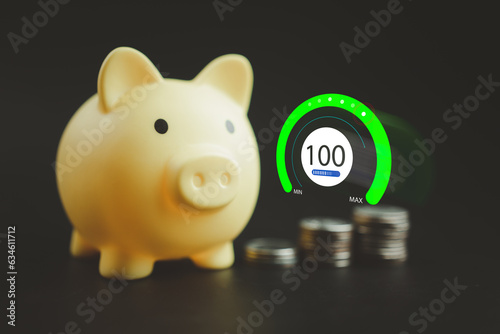 Yellow cute piggy bank and blurred background of coins with icons of complete one hundred. The concept of completely to saving money