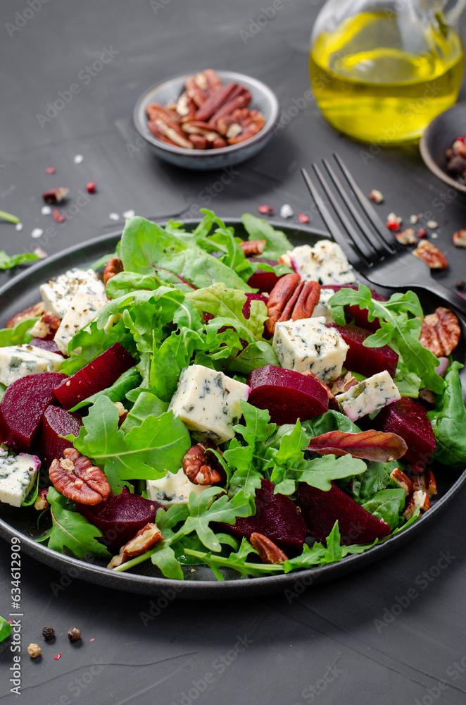 Beetroot Salad with Blue Cheese, Nuts and Salad Mix over Dark Background