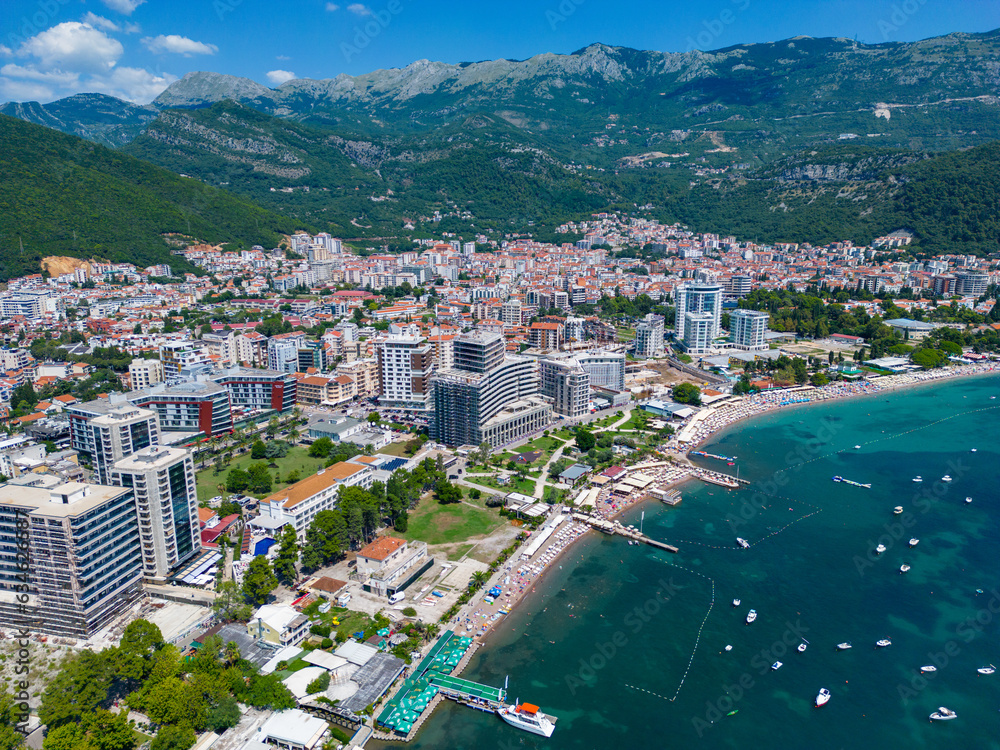City of Budva in Montenegro. Aerial view of Port and Beach Greco. Coastline of the Adriatic Sea at summer time. Natural landscapes of Montenegro. Balkans. Europe.