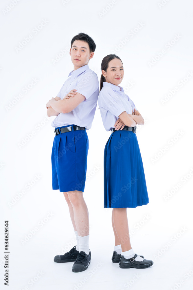 Back to school. Thai students. Asian girl and boy standing together friendly in students uniform on white background. Back to school. Thai students. Asian girl and boy standing together friendly in students uniform on white background.