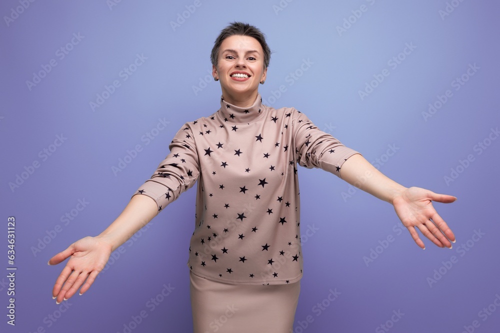 joyful emotional young caucasian dark-haired lady in a skirt and blouse with a short haircut joyful emotional young caucasian dark-haired lady in a skirt and blouse with a short haircut