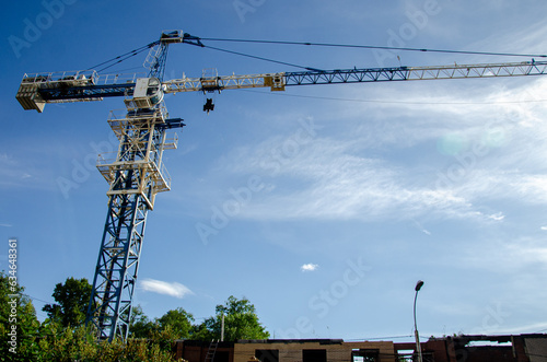 Large metal construction crane against the sky