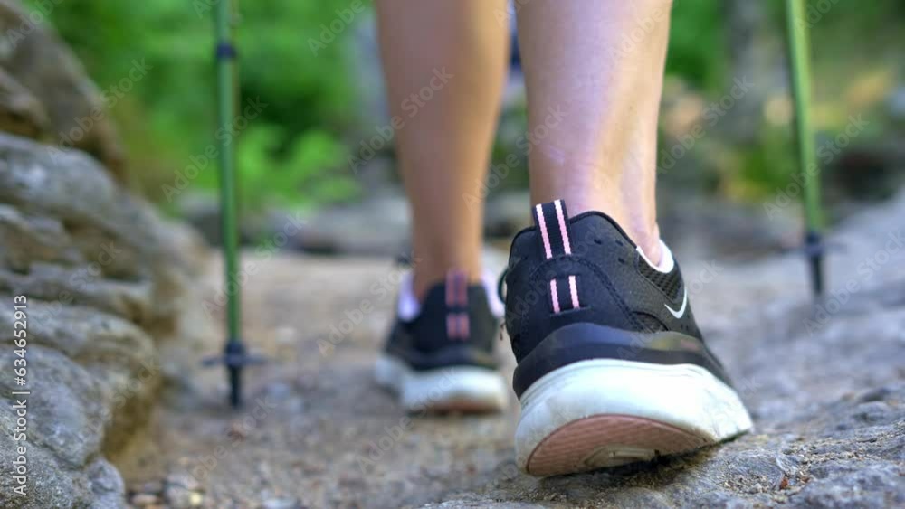 Women's feet with slippers hiking along the forest path, Guadarrama, Madrid. Women's feet with slippers hiking along the forest path, Guadarrama, Madrid.