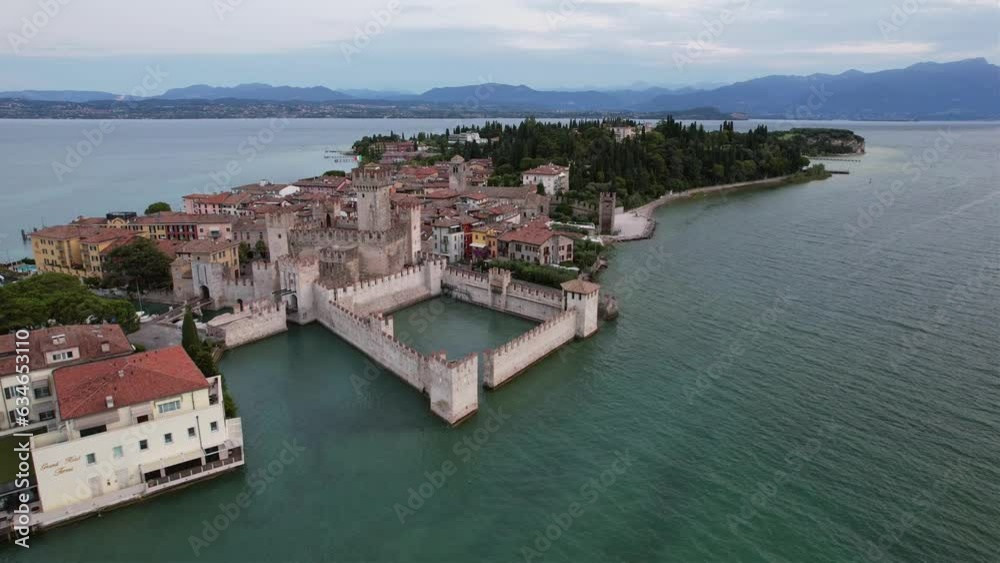 Aerial video of the historic Scaliger Castle in the Italian town of Sirmione on the shores of Lake Garda. Aerial video of the historic Scaliger Castle in the Italian town of Sirmione on the shores of Lake Garda.