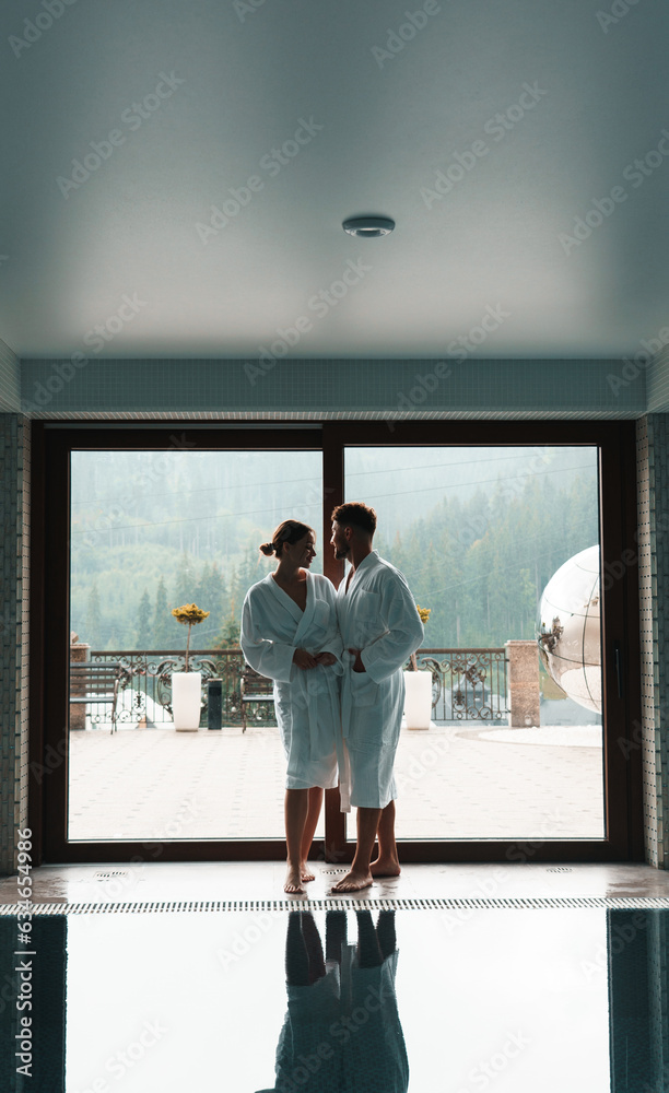 Happy young couple enjoying treatments and relaxing at wellness spa center Happy young couple enjoying treatments and relaxing at wellness spa center