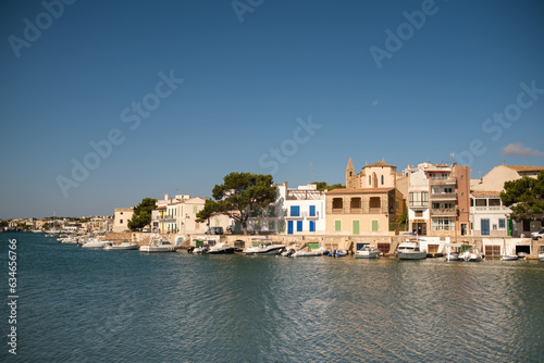 Boats near houses in coastal city