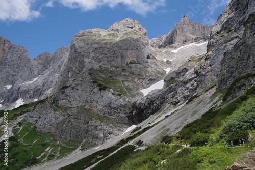 Beautiful mountain views on tourist trail from Turlwand to Oberhofalm. Trekking under majestic walls of Hocher Dachstein massif, Austria, Austrian Alps	
 photo