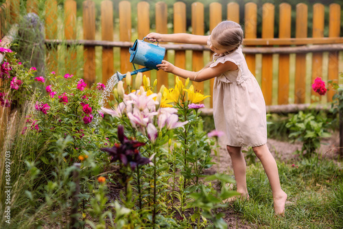 a girl with a watering can watering flowers, cheerful, laughing, summer, garden, vegetable garden, village