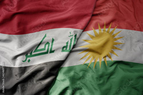 big waving realistic national colorful flag of iraq and national flag of kurdistan . photo