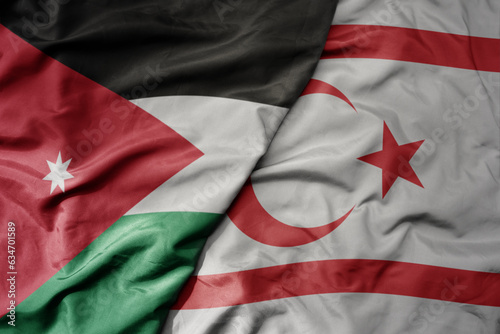 big waving realistic national colorful flag of jordan and national flag of northern cyprus .