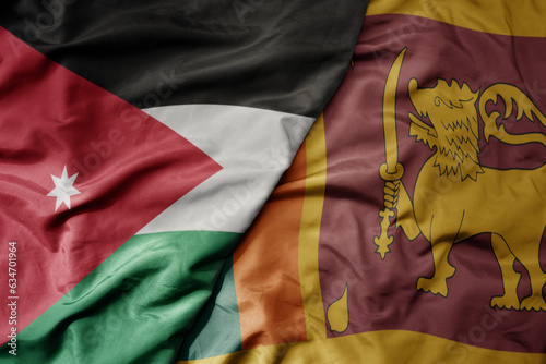 big waving realistic national colorful flag of jordan and national flag of sri lanka .