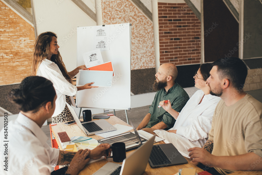 Group of young people designers having meeting in a modern office. Group of young people designers having meeting in a modern office.